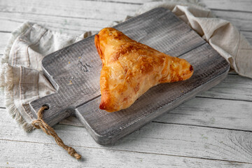 Placinda pie stuffed with cottage cheese and herbs. Rich pastries.