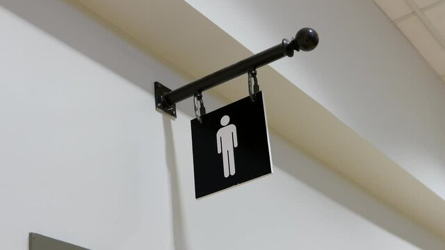 The motion of man washroom logo on the wall with 4k resolution
