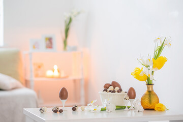 Easter decorations with spring flowers in white interior