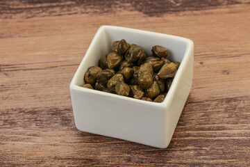 Tasty capers in the bowl