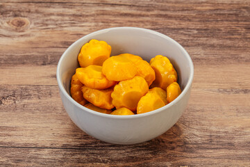 Marinated yellow patisson in the bowl