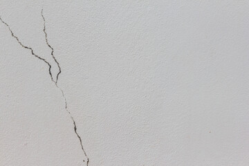 White plaster wall cracks Cracked house wall.