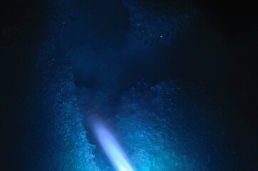 Fototapeta na wymiar blue gas flame melting white snow at night