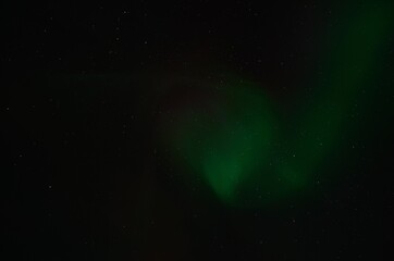 aurora borealis, northern light on winter night sky in northern Norway