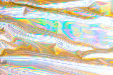 Holographic iridescent mermaid foil texture background. Futurist
