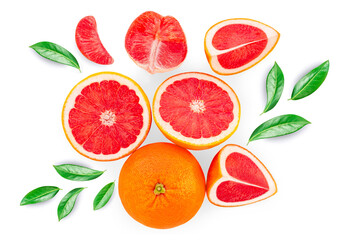 Grapefruits isolated  on white background, top view. Citrus fruits pattern. Creative layout made of Grapefruit slices and green leaves. Top view. Flat lay.