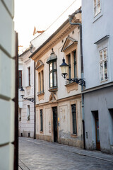 Fototapeta na wymiar Beautiful street of old town in Bratislava. Typical European alley. Historical buildings, empty street with no tourists, coronavirus outbreak.