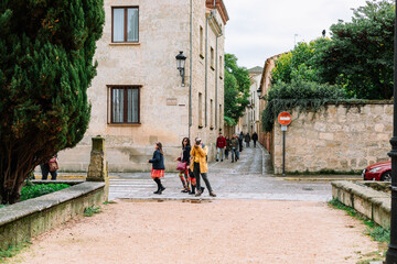Fototapeta na wymiar Girl in yellow jacket street photography Spain
