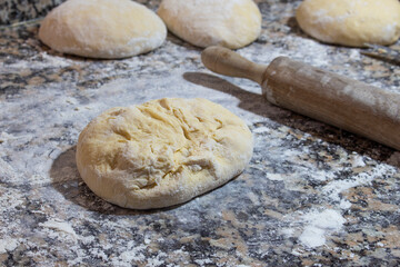 Making buns at home. The process of kneading wheat buns. 