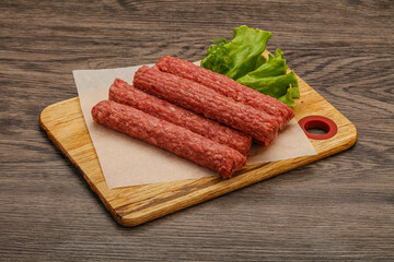 Raw beef sausages with spices