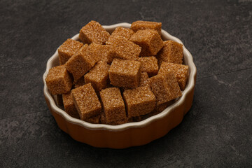Cane sugar cubs in the bowl