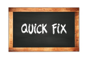 Fototapeta premium QUICK FIX text written on wooden frame school blackboard.