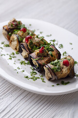 Aubergine rolls with nuts, cilantro, pomegranate