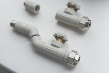 Modern polypropylene water tap witn and separately polypropylene pipe isolated on white background