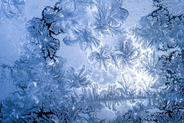 blue texture of frost ice surface with frozen design tracery ,cold cryslallized surface background...