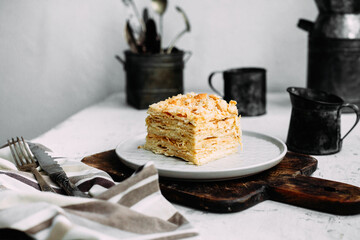 Napoleon cake in a plate on the table