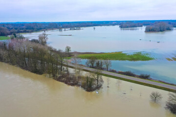 Drone photography of the flooded floodplains of the german Rhine River near Wörth, Maxau in Germany. Flood disaster in winter.