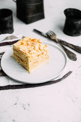 Napoleon cake in a plate on the table