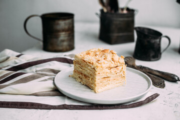 Napoleon cake in a plate on the table