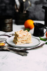 Napoleon cake in a plate on the table