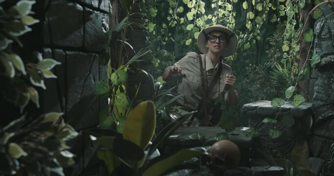 Explorer finding ancient ruins in the forest