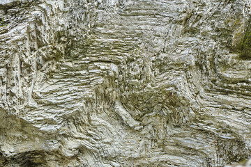 Texture of the surface of a wild stone, rock, or block. Natural material