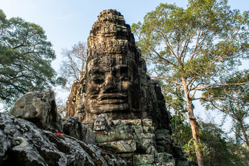Fototapeta na wymiar Angkor Wat ancient sculpture in the jungle of Cambodia 