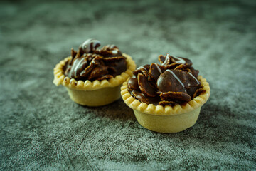 Chocolate cornflakes tart on cement ground. Close up desserts. Homemade desserts.
