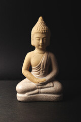Buddha statue on black background