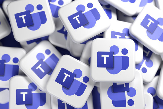 Logos of the video conferencing and collaboration technology brand Microsoft Teams on a heap. Full frame image - Selective focus