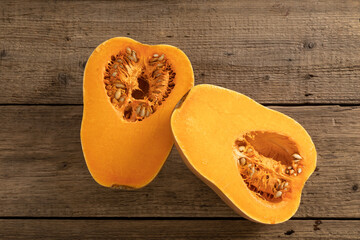 Ripe pumpkin fruits on wooden background
