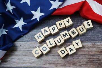 Fototapeta na wymiar Happy Columbus day Word alphabet letters with USA flag on wooden background