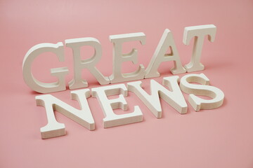 Great News word alphabet letters on pink background
