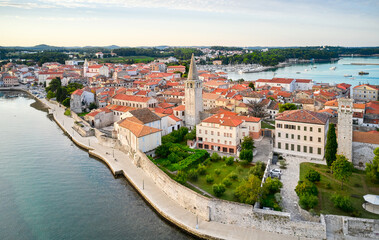 Fototapeta na wymiar A fragment of the old town embankment with the cathedral. Porec, Croatia. Shooting from a drone.