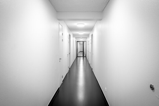 Empty white hallway in black and white
