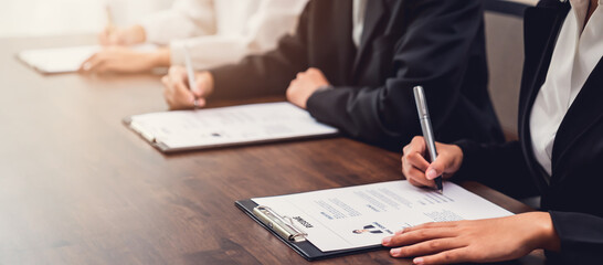 Business people fill resume application information on the desk, presents the ability for the...
