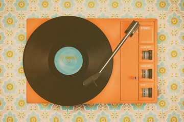 Record player on top of flower wallpaper