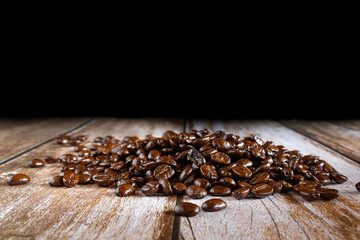 Coffee beans background on wooden table