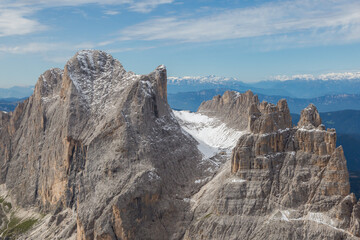 Fototapeta na wymiar rifugio vajolet and towers with snow in italian dolomite mountains