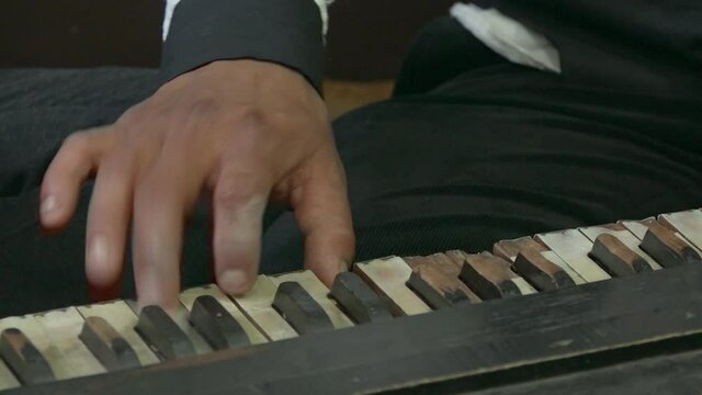 Men playing harmonium and madal, Kathmandu, Bagmati Province, Nepal