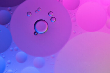 macro oil water photography Abstract background and texture of bubbles light multi color illumination.  art water surface for your products display and artwork design with copy space. Watery glare 