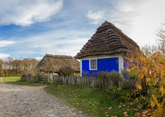 Fototapeta na wymiar Old Ukrainian rural house with blue walls, Pyrohiv, Kyiv, Ukraine