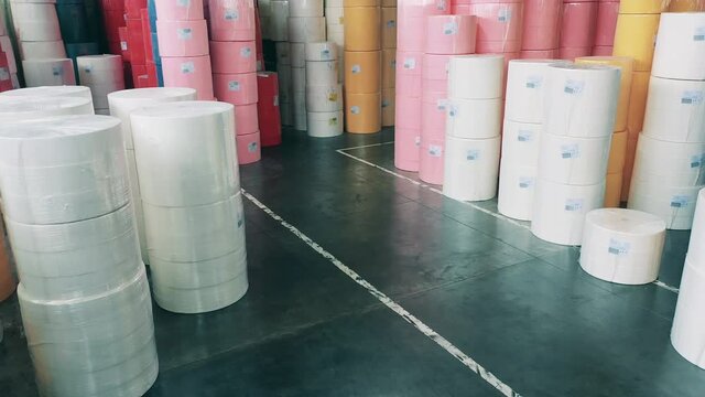 Large warehouse full of big paper rolls