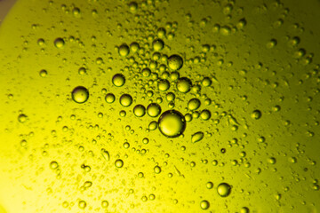 macro oil water photography Abstract background and texture of bubbles light multi color illumination.  art water surface for your products display and artwork design with copy space. Watery glare 