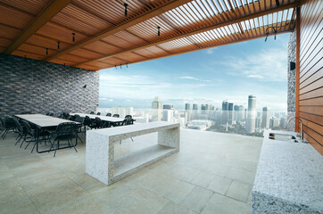 Modern sky lounge  and kitchen on roof top and stunning cityscape view. 3D rendering