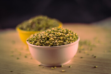 Broken Mung Lentils (Moong Dal) spilled on agriculture background,green moong dal in bowl,Peeled Green Beans.