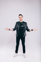 Beautiful young man in studio in jacket