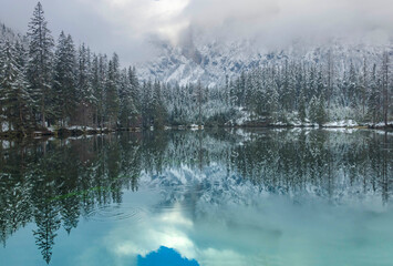 Amazing winter landscape with snowy mountains and clear waters of Green lake (Gruner see), famous tourist destination in Styria region, Austria