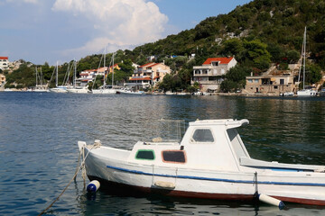 Fototapeta na wymiar Small fishing boat in the picturesque port on island Lastovo, Croatia.