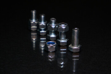 Bolts with nuts on 8mm on black background